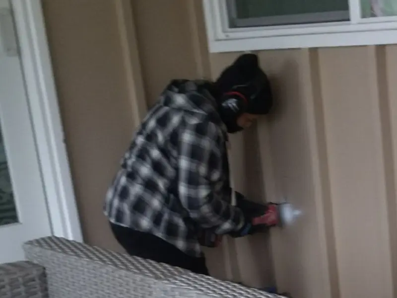 Professional electrician installing an exterior outlet in Union City